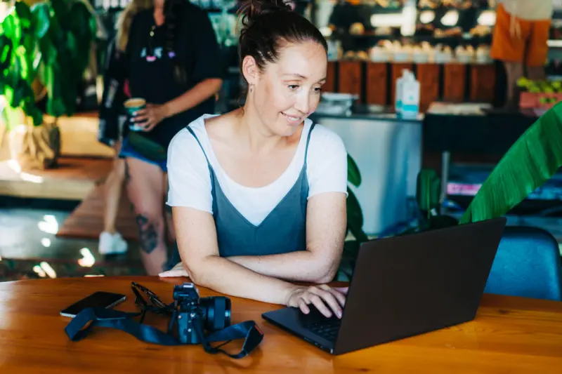 confident beautiful middle-aged woman photographer